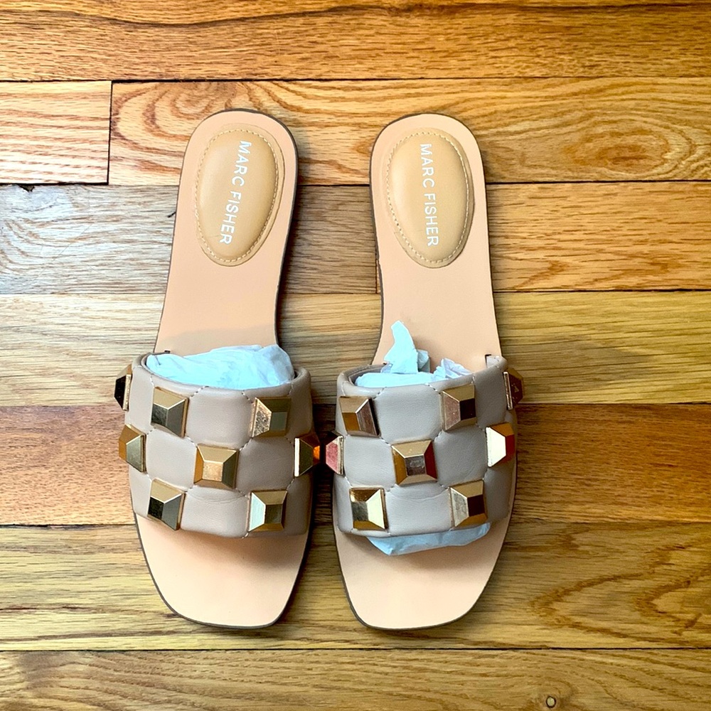 Neutral beige rock stud open toed flat slide by Marc Fisher